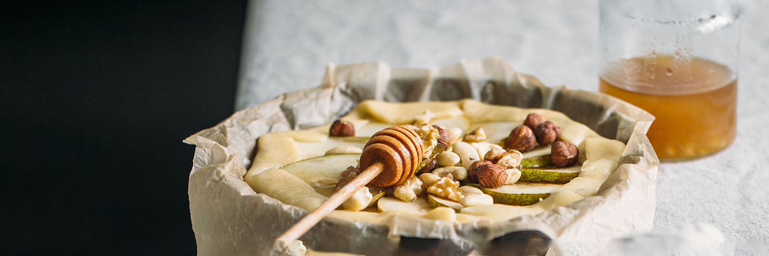 Homemade fresh pear galette with goat cheese and walnuts